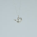 product image of a sterling silver cardinal charm on a chain necklace facing right