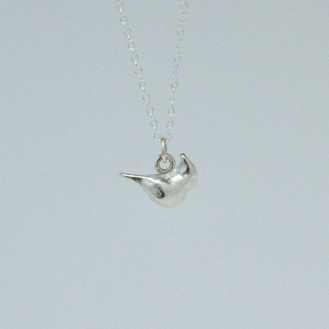 product image of a sterling silver cardinal charm on a chain necklace facing right